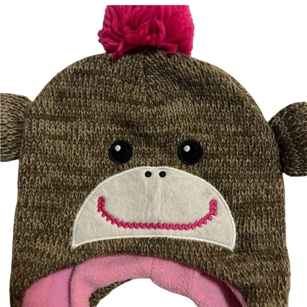 Adorable brown and pink winter monkey hat with pink pom poms